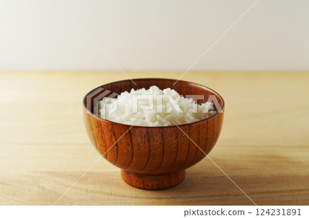 Rice served in a wooden bowl Rice served in a wooden bowl 124231891