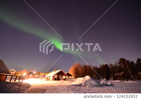 Inari, Finland, is located within the Arctic Circle and has a high chance of seeing the Northern Lights. 124232652