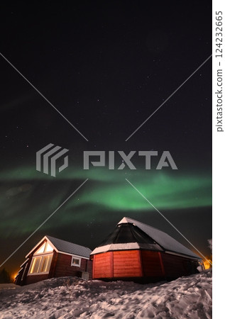 Inari, Finland, is located within the Arctic Circle and has a high chance of seeing the Northern Lights. 124232665