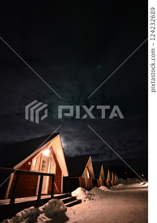 Inari, Finland, is located within the Arctic Circle and has a high chance of seeing the Northern Lights. 124232689