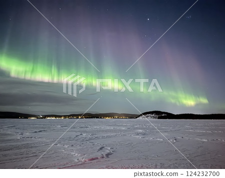 Inari, Finland, is located within the Arctic Circle and has a high chance of seeing the Northern Lights. 124232700