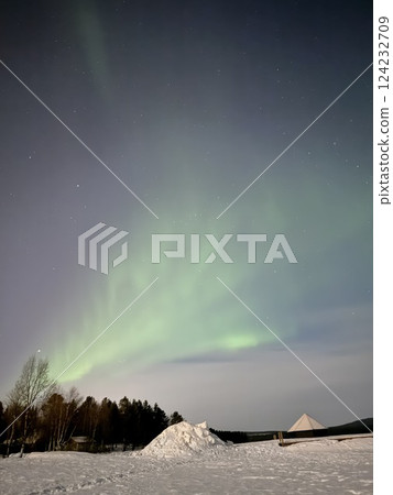 Inari, Finland, is located within the Arctic Circle and has a high chance of seeing the Northern Lights. 124232709
