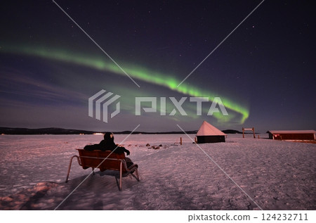 Inari, Finland, is located within the Arctic Circle and has a high chance of seeing the Northern Lights. 124232711