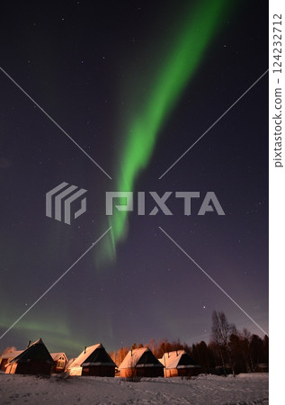 Inari, Finland, is located within the Arctic Circle and has a high chance of seeing the Northern Lights. 124232712