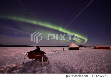 Inari, Finland, is located within the Arctic Circle and has a high chance of seeing the Northern Lights. 124232742