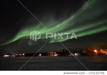 Inari, Finland, is located within the Arctic Circle and has a high chance of seeing the Northern Lights. 124232748