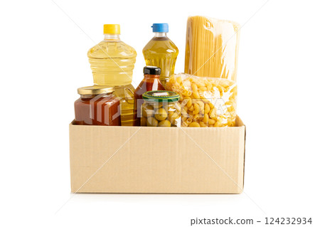 Foodstuffs in donation box isolated on white background for volunteer to help people. 124232934