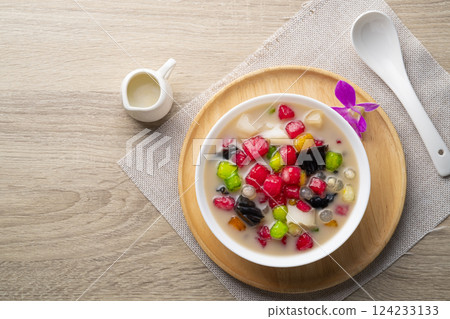 Thai iced dessert (Ruam Mit),Popular Thai dessert made with ingredients such as coconut jelly, tapioca pearls,thapthim krop,mock pomegranate seeds,Grass Jelly in coconut milk.Top view 124233133