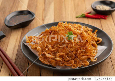 Thai Styled Shrimp Fritter,Asian Street Food.Deep fried small shrimp with chilli dipping sauce. 124233138