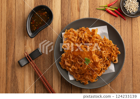 Thai Styled Shrimp Fritter,Asian Street Food.Deep fried small shrimp with chilli dipping sauce. 124233139