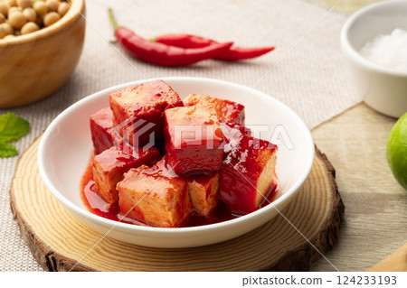 Fermented bean curd in white plate(Red Sufu) ,Chinese Cheese Fermented bean curd in white plate(Red Sufu) ,Chinese Cheese 124233193