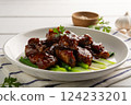 Close up Honey Braised Pork Baby Back Ribs or pork cartilage with soy sauce in white plate. 124233201