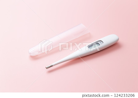Thermometer on a pink background 124233206