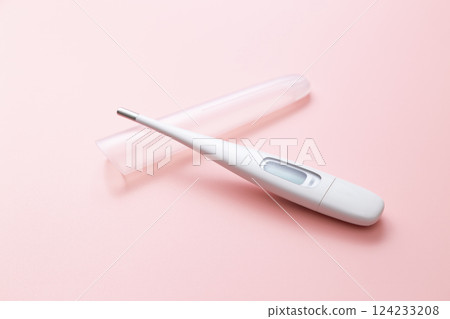 Thermometer on a pink background 124233208