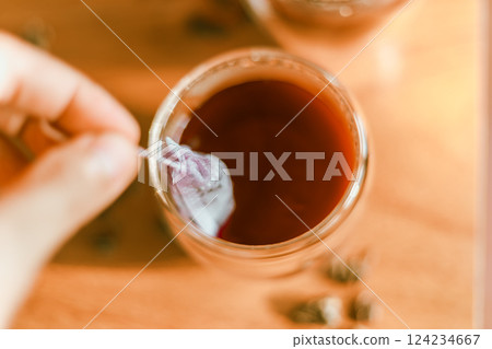 Red tea o in the small clear glass 124234667
