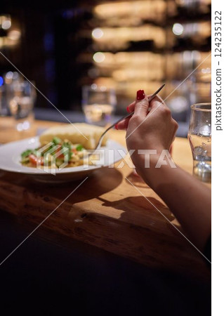 Whole tied Italian cheese burrata on small wooden plate served with fresh tomatoes and basil Whole tied Italian cheese burrata on small wooden plate served with fresh tomatoes and basil 124235122