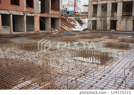 Construction underground floor building. Foundation house with metal fittings 124235253