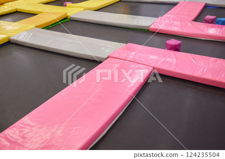 Set of trampolines at indoor play center playground. Set of trampolines at indoor play center playground. 124235504