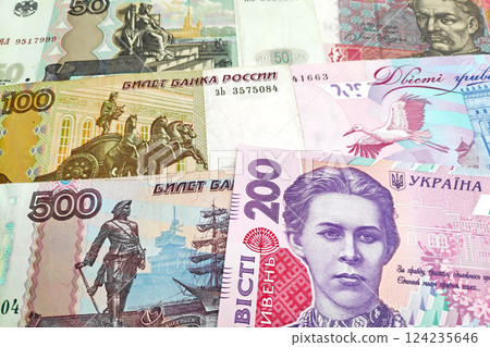 Stack of Russian Rubles and Ukrainian Hryvnia 124235646