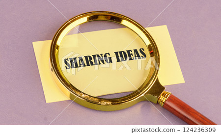 A magnifying glass highlights sharing ideas on yellow paper, showcasing the value of collaboration in education and business A magnifying glass highlights sharing ideas on yellow paper, showcasing the value of collaboration in education and business 124236309