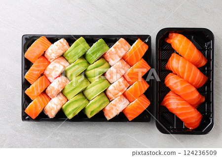 Japanese sushi rolls, sushi sets on a gray background for restaurant menu and food delivery Japanese sushi rolls, sushi sets on a gray background for restaurant menu and food delivery 124236509
