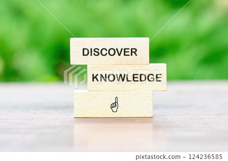 Wooden blocks display the words discover and knowledge, symbolizing the importance of education in business and finance Wooden blocks display the words discover and knowledge, symbolizing the importance of education in business and finance 124236585
