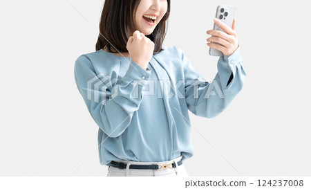 A woman/businesswoman happy to see her smartphone 124237008