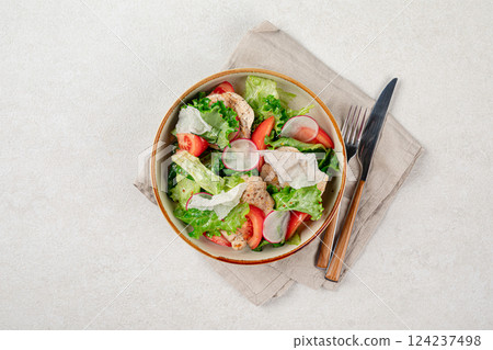 Portion of vegetables salad with chicken 124237498
