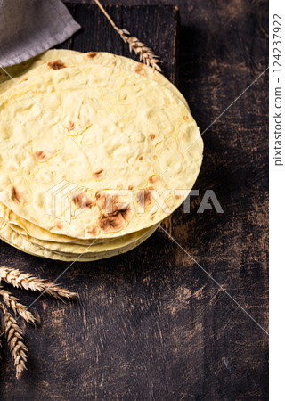 Lavash flat bread on green background Lavash flat bread on green background 124237922