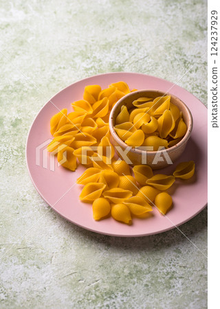 Raw pasta in shape of shells 124237929