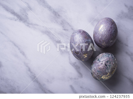 Easter painted eggs with marble effect Easter painted eggs with marble effect 124237935