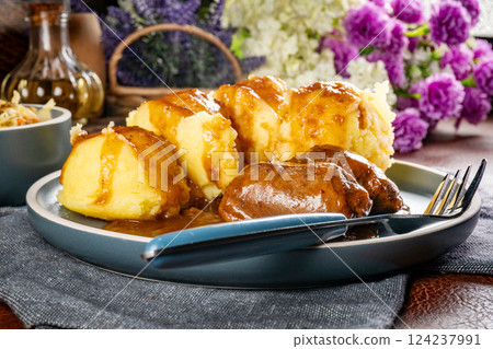 Traditional German braised pork cheeks in brown sauce. Traditional German braised pork cheeks in brown sauce. 124237991