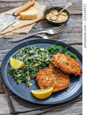 chicken patties with kale almond parmesan salad chicken patties with kale almond parmesan salad 124238471