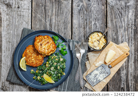 chicken patties with kale almond parmesan salad chicken patties with kale almond parmesan salad 124238472