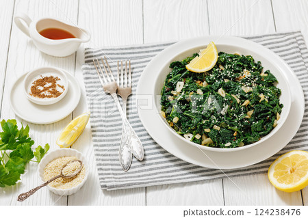 sauteed kale with garlic, onion, red pepper flakes sauteed kale with garlic, onion, red pepper flakes 124238476