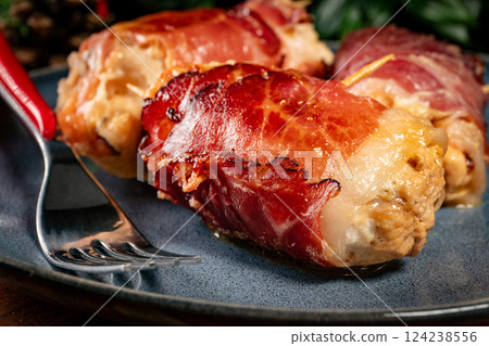 Chicken breast  wrapped with bacon. 124238556