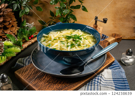 Broth - chicken soup in a bowl. Broth - chicken soup in a bowl. 124238639