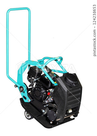 Powerful compactor plate designed for compacting surfaces in construction and landscaping projects. Isolated on white background. 124238653