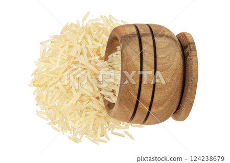 rice basmati in a wooden bowl isolated on white background. Top view. Flat lay rice basmati in a wooden bowl isolated on white background. Top view. Flat lay 124238679