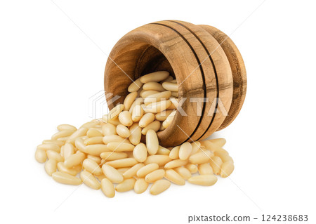 Shelled European pine nuts in wooden bowl isolated on white background with full depth of field Shelled European pine nuts in wooden bowl isolated on white background with full depth of field 124238683
