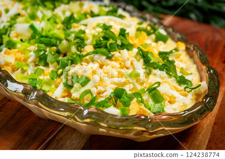 Herring salad in mustard and egg sauce. 124238774