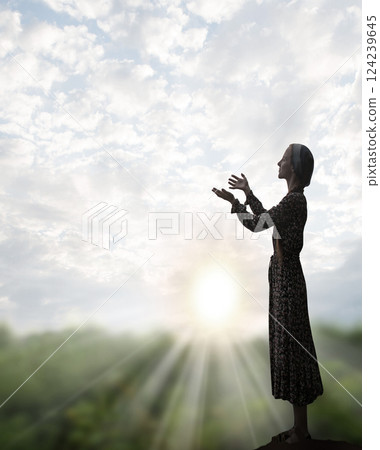 Young girl praying to God Young girl praying to God 124239645