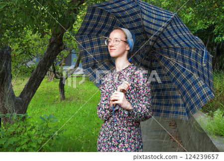 Young girl with an umbrella 124239657