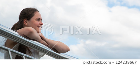 Young girl looking to the sky Young girl looking to the sky 124239667