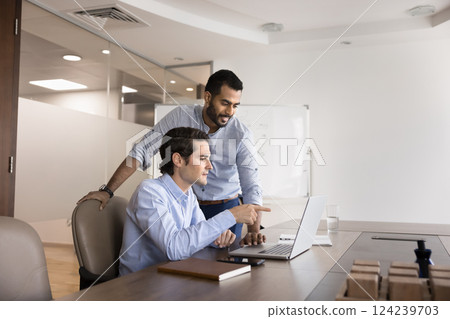 Hispanic man asking about task, new corporate software to mentor Hispanic man asking about task, new corporate software to mentor 124239703
