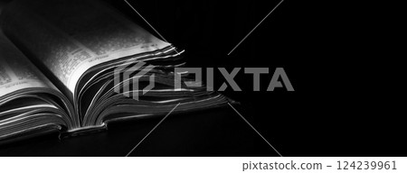 Dark table with open bible 124239961