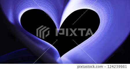 Book pages folded in the shape of a heart 124239981