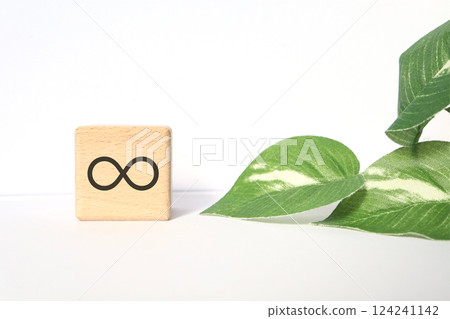 Infinity symbol written on a wooden block Infinity symbol written on a wooden block 124241142