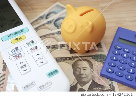 Air conditioner remote control, calculator and banknotes - Image of air conditioner electricity bill Air conditioner remote control, calculator and banknotes - Image of air conditioner electricity bill 124241161