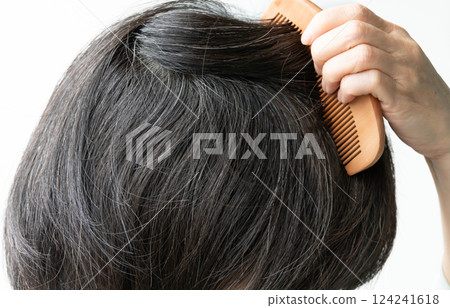 Japanese woman with grey hair combing her hair 124241618